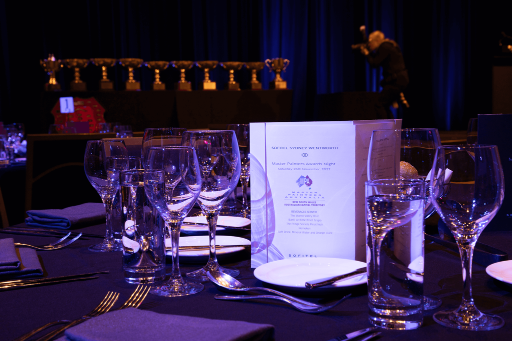 AFE 2022 - Dinner Table 3 with trophies in background
